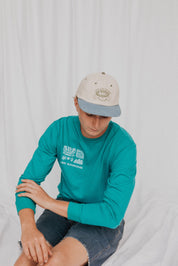 front of les Saisons long sleeve, made in canada turquoise, outdoorsy club